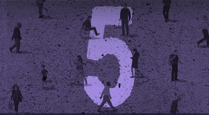 The number five printed on the ground with people wandering all around the area.