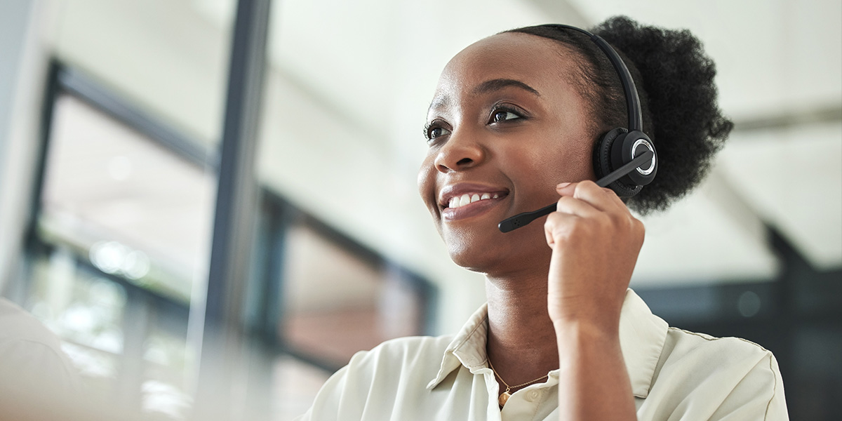 Woman providing customer service with help from CRM automation.