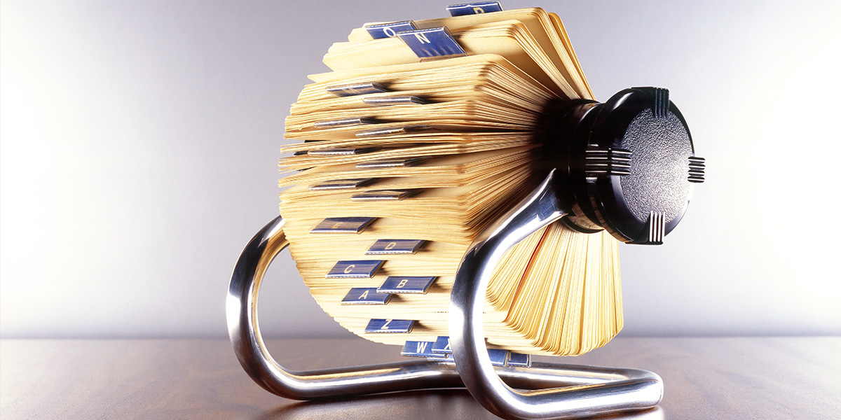 Rolodex picture to show similarities between a rolodex and CMS vs. CRM