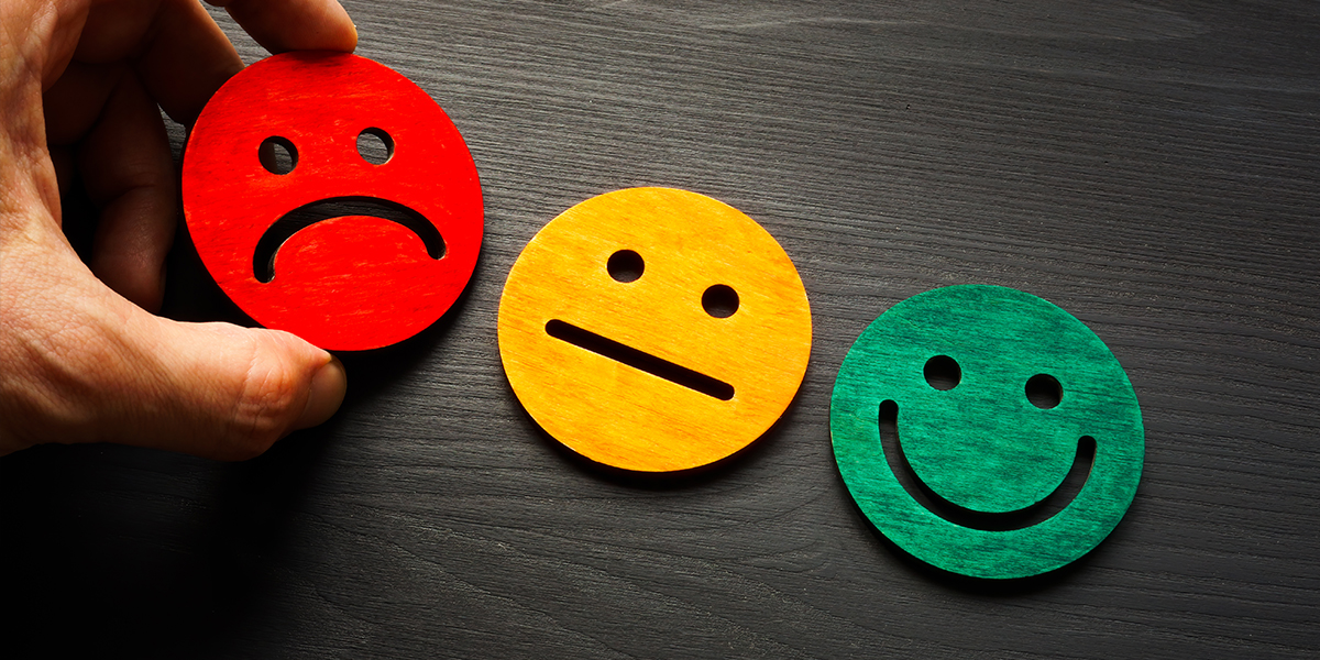 Happy/sad faces showing customer experience CRM