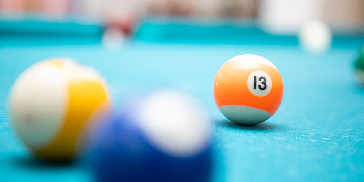 Billiard ball with the number 13 representing 13 crm evaluation criteria