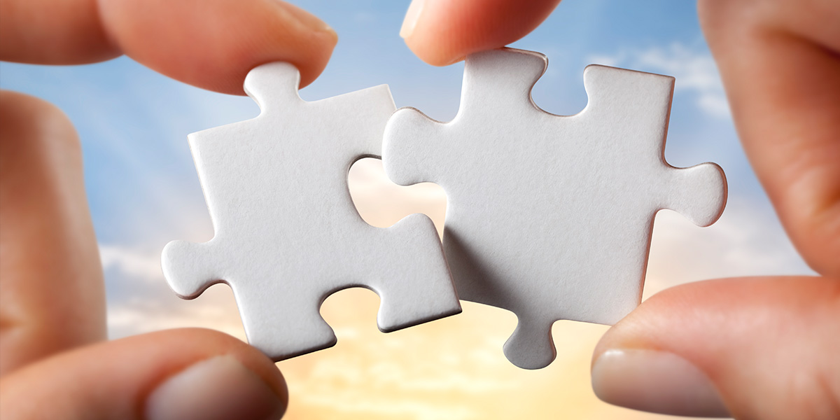 Puzzle pieces representing a marketing and sales team