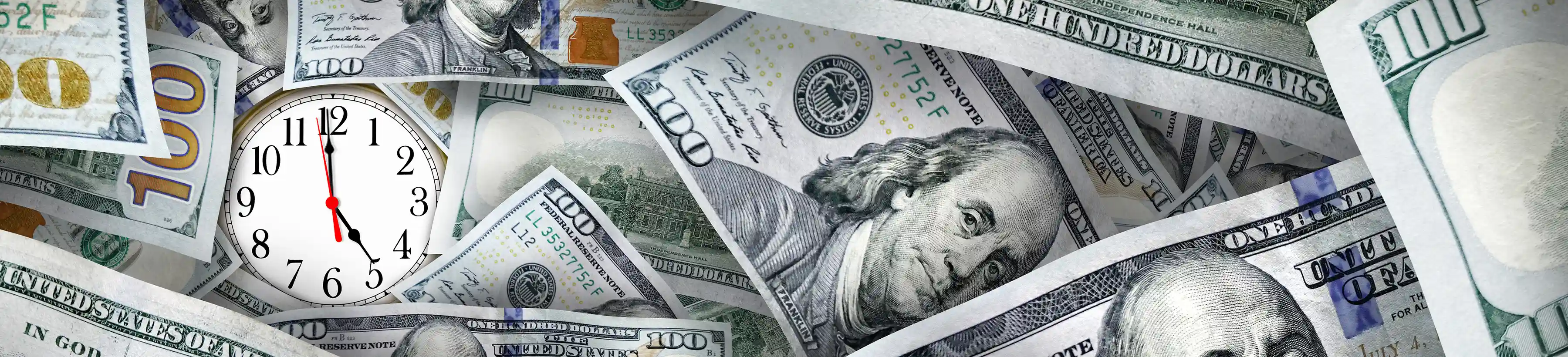 Dollar bills with a clock